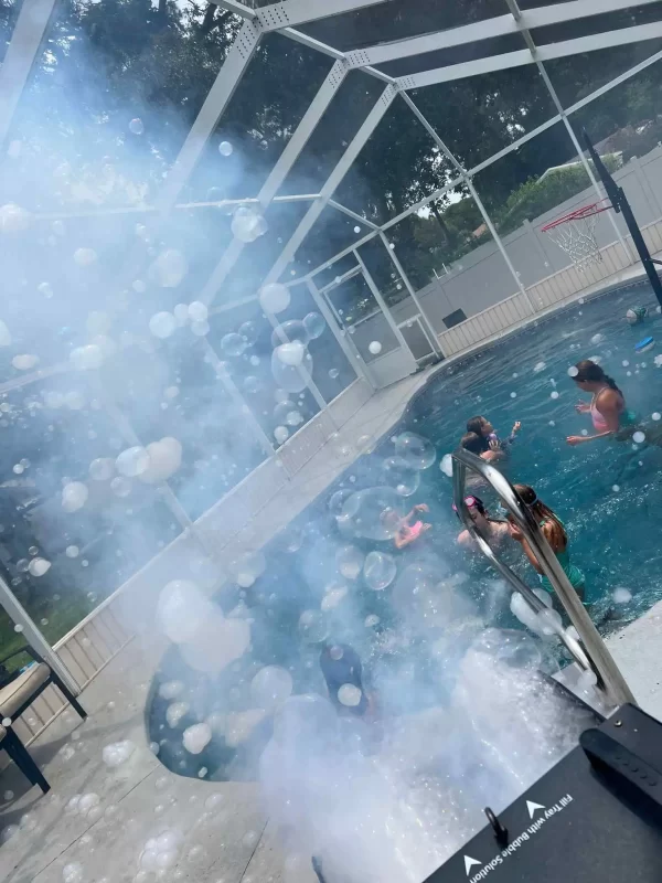 A group of people in a Texas pool with bubbles coming out of it.