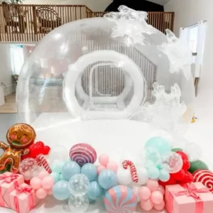 An enchanting bubble house rental with candy canes and balloons.