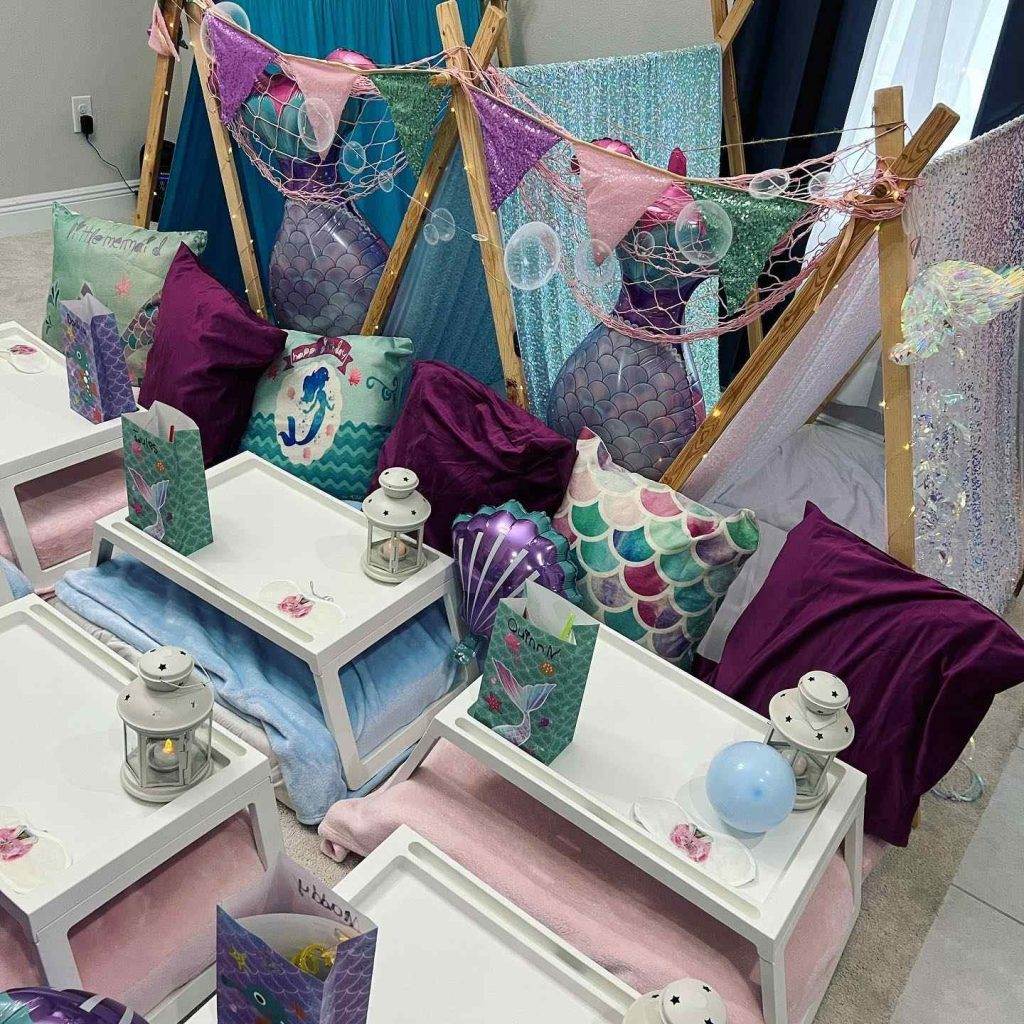 A Texas mermaid themed party rental with tents and pillows.