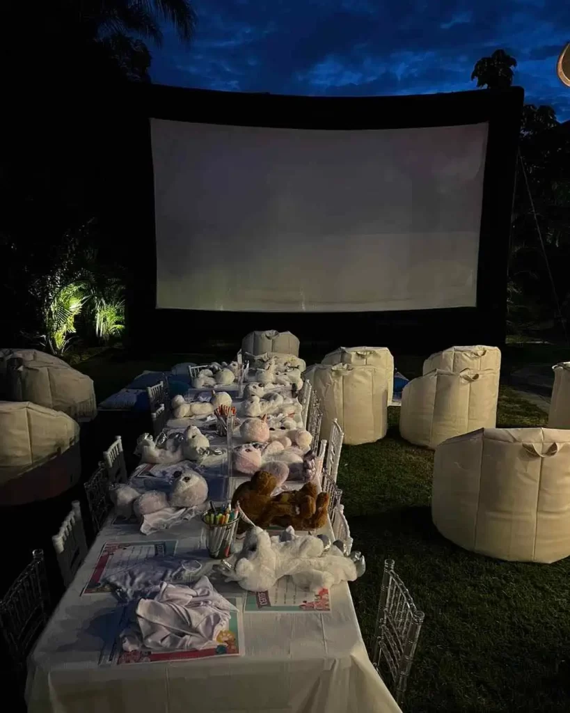 An outdoor movie theater, arranged as a party rental in Texas, set up for a baby shower.