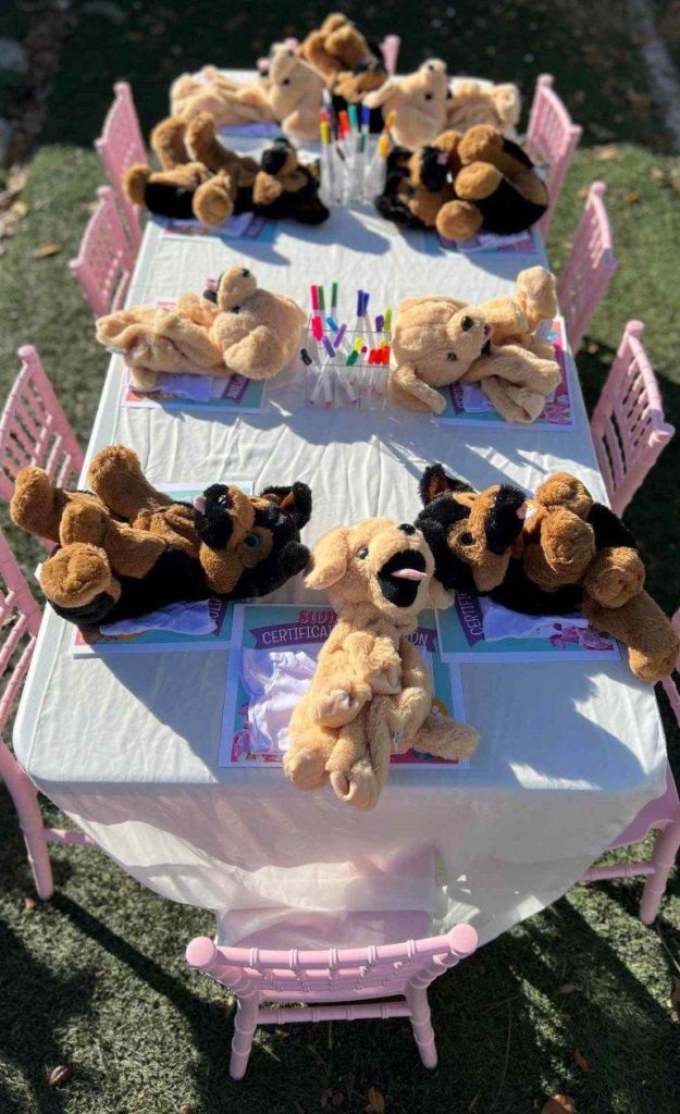 A table with teddy bears on it, available for party rental in Texas.