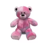 A pink and blue teddy bear sitting on a white background in Texas.